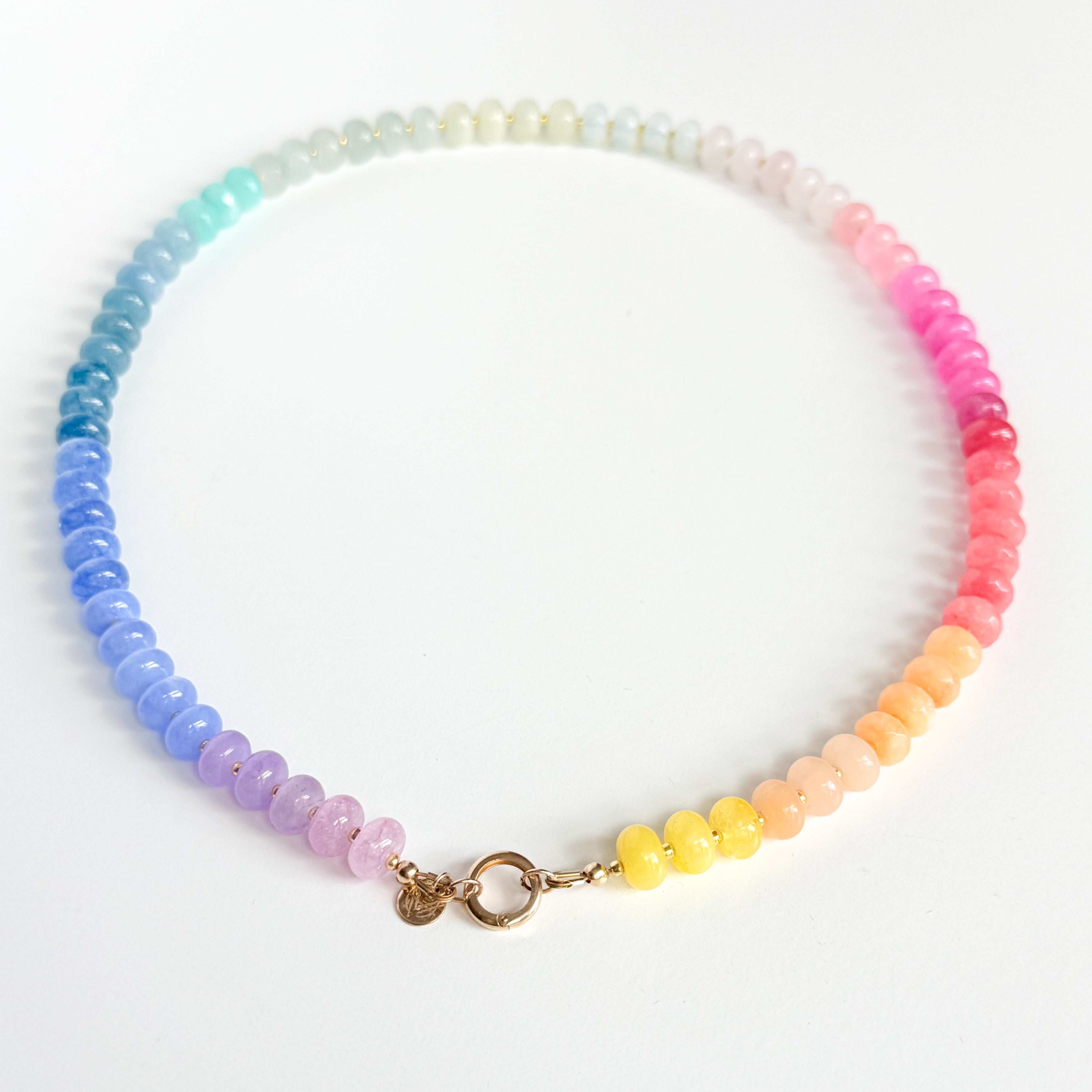 Multicolored beaded necklace on a white background