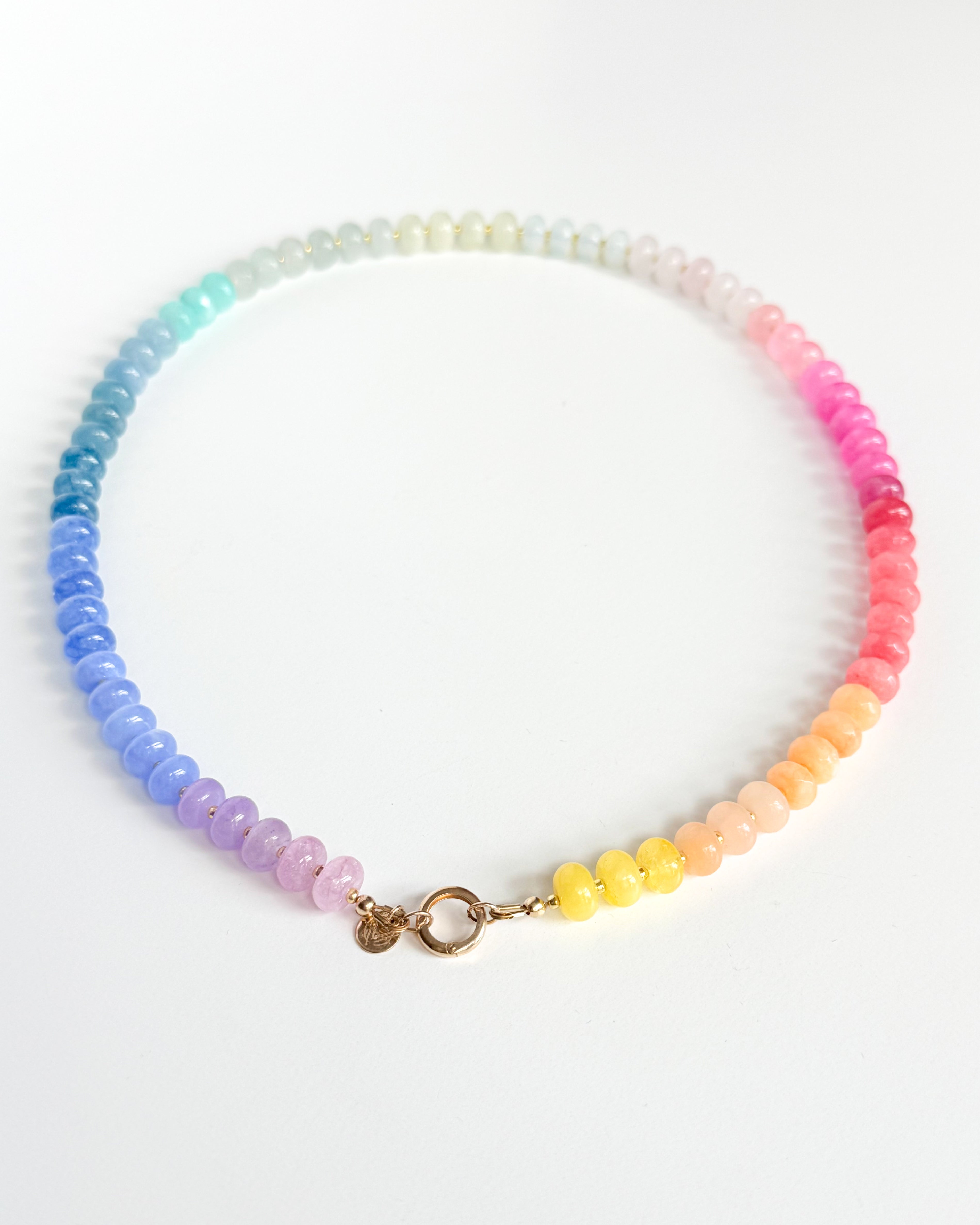 Multicolored beaded necklace on a white background