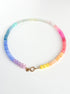 Multicolored beaded necklace on a white background