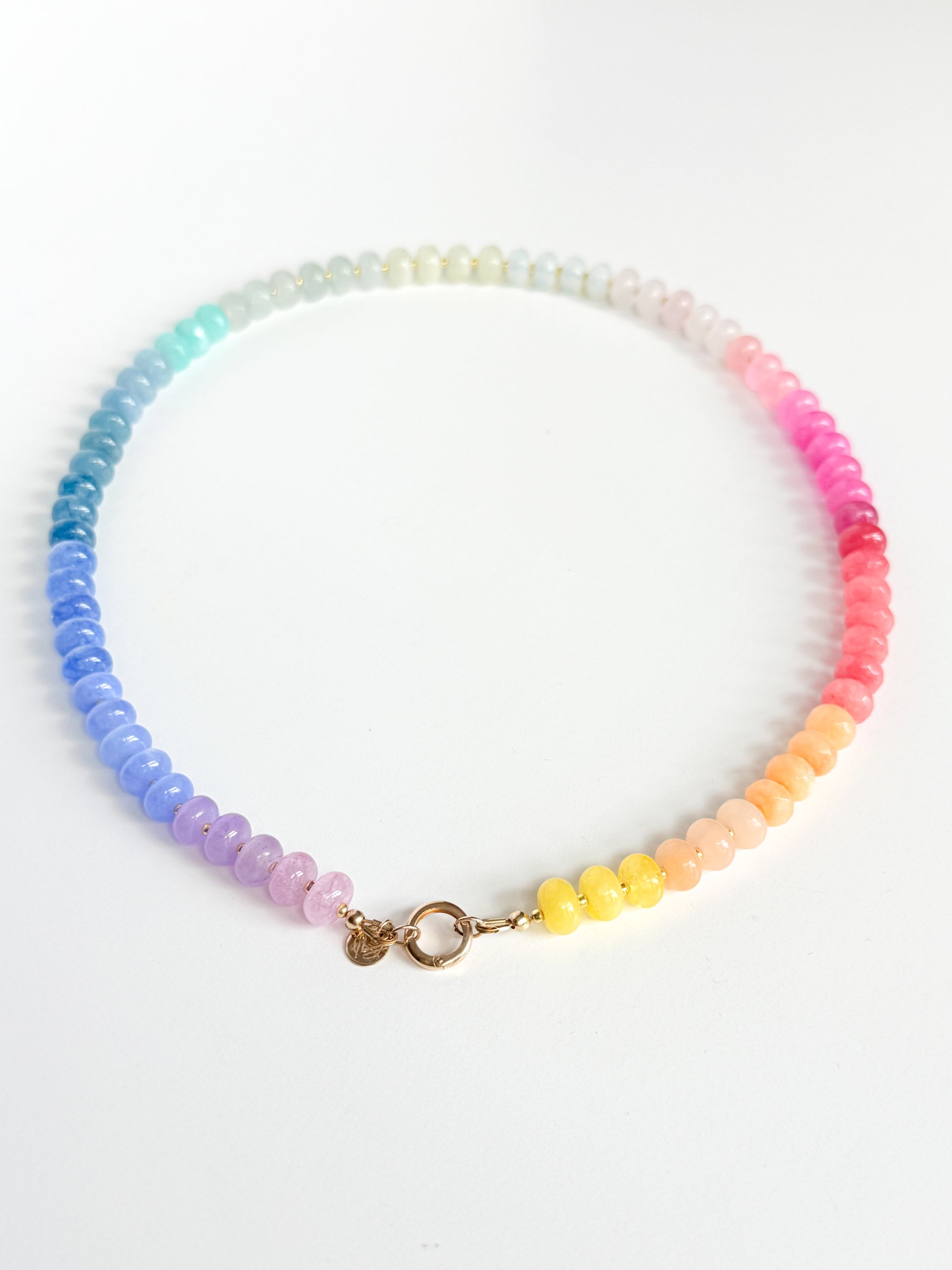 Multicolored beaded necklace on a white background