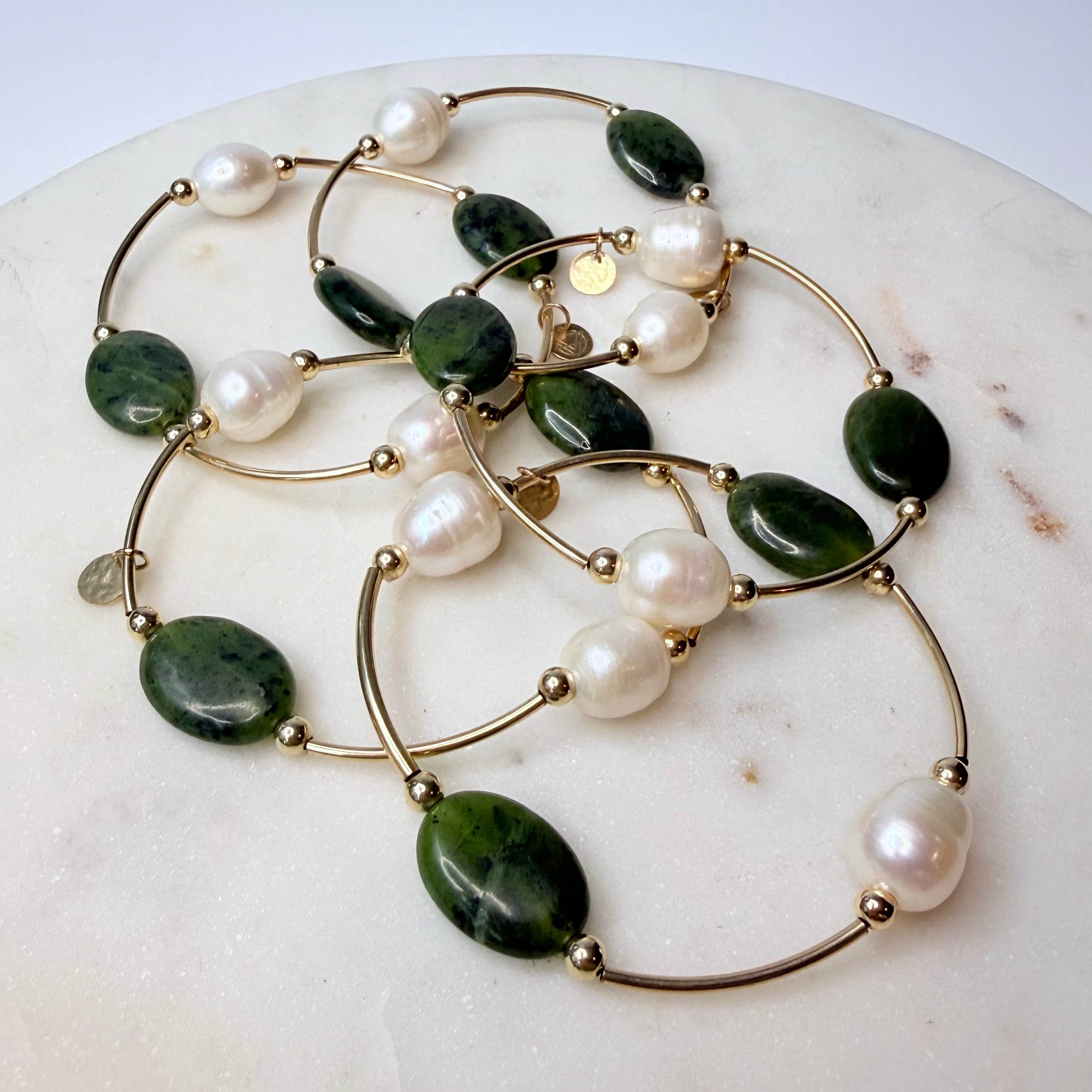 Multiple Olivine jade and freshwater pearl gold-filled bracelets by Gypsy & Gem