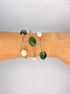 Olivine jade and freshwater pearl 14k gold-filled roll-on bracelets worn in a stack